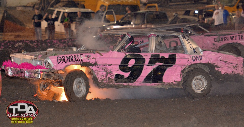 demo derby car in flames