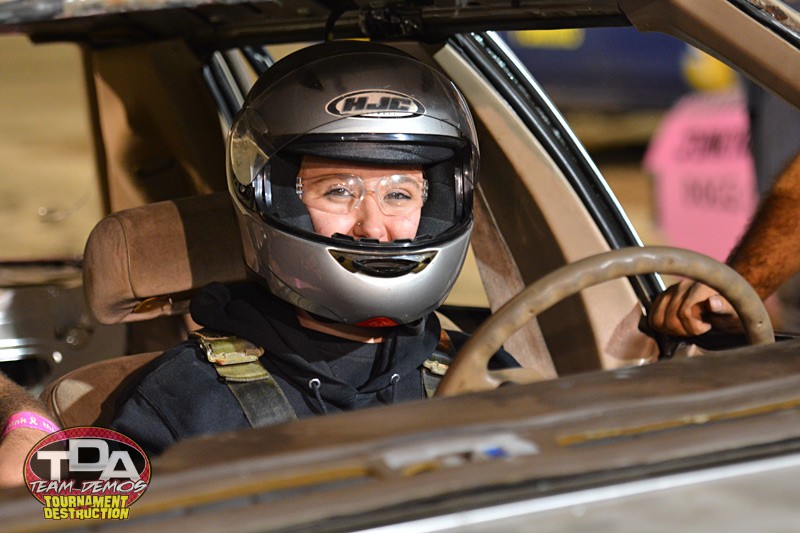 woman demo derby driver in helmet